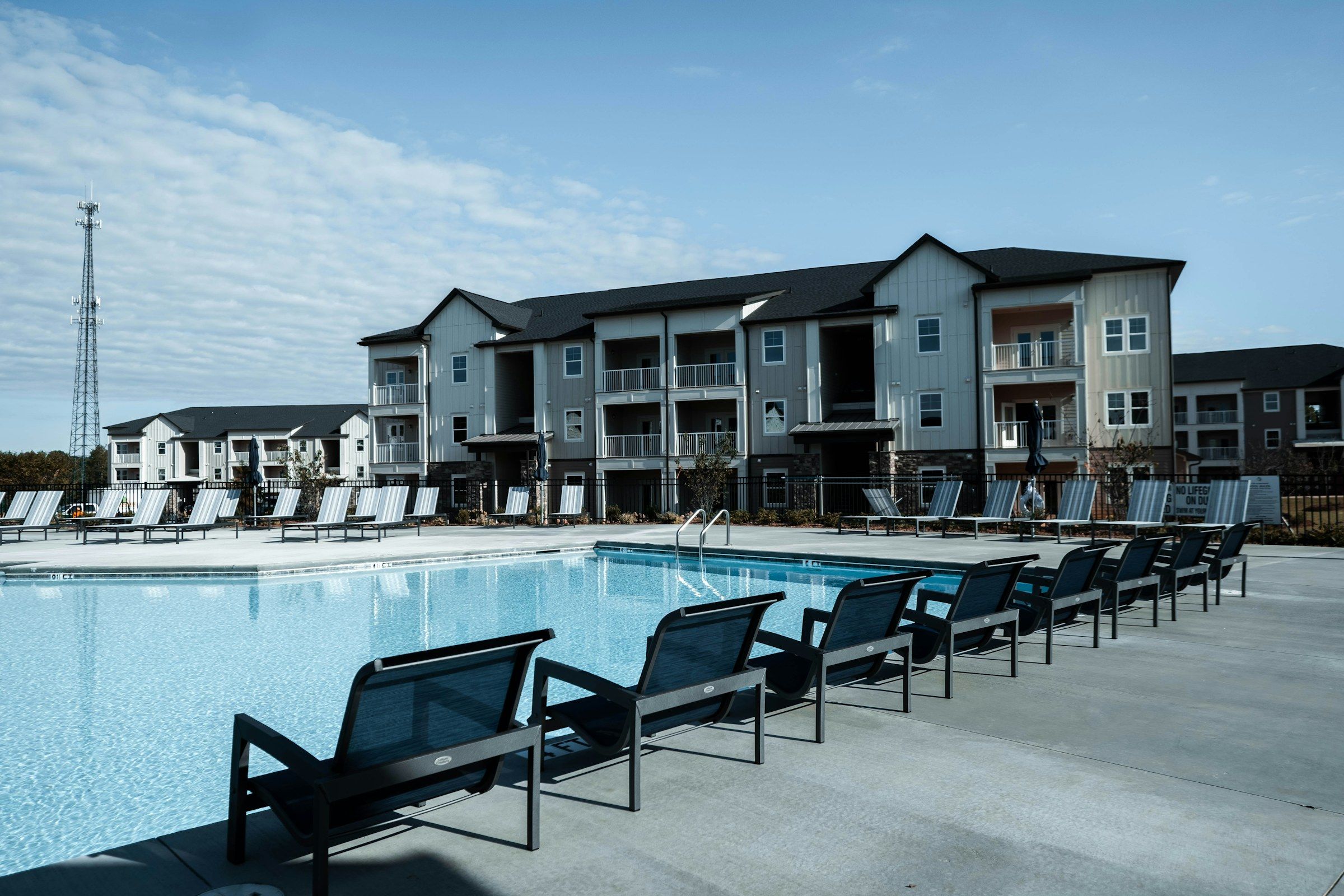 Garden-style apartment buildings around a community pool