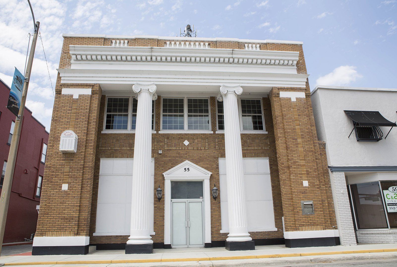 RLW Realty's office, a historic columned building at 55 N. Central Avenue in downtown Umatilla